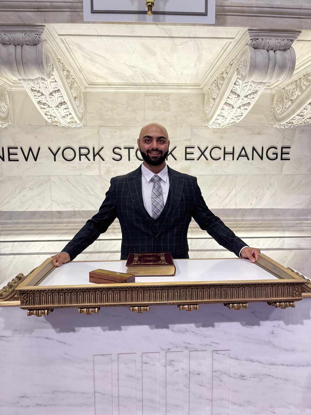 Mehul Patel at the New York Stock Exchange podium